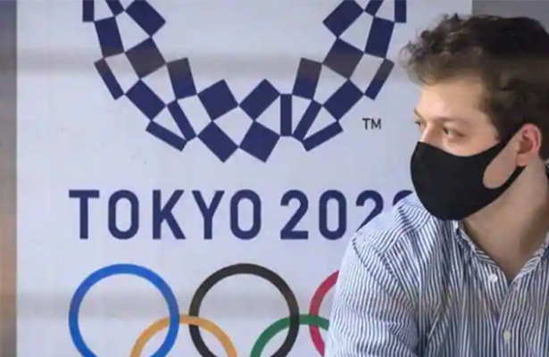 Japan may keep some virus curbs until Games start