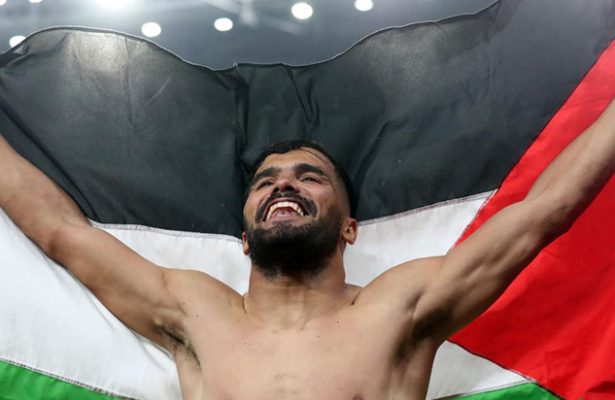 Algerian team raise Palestinian flag after beating Morocco